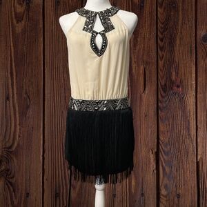 Ark & Co. sassy mini fringe flapper dress is perfect for any occasion. Size S
